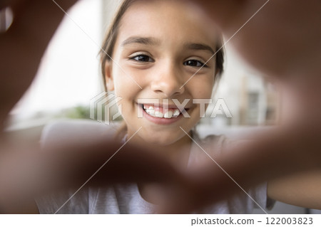 Close up webcam view beautiful face of little Hispanic girl 122003823