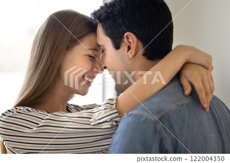 Happy young couple in love hugging with noses touch 122004350