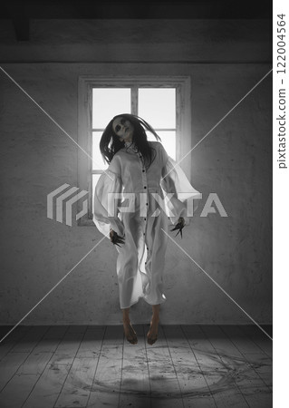 Creepy scene with pale, dark-haired woman in white gown levitating in air with hypnotic gaze, illuminated by light from a window. Creepy scene with pale, dark-haired woman in white gown levitating in air with hypnotic gaze, illuminated by light from a window. 122004564