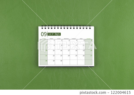 September 2025 Monthly desk calendar on green leather background. September 2025 Monthly desk calendar on green leather background. 122004615