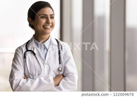 Doctor looking away, absorbed in thoughts, relish her professional success 122004678