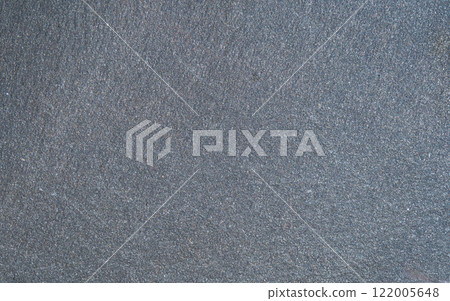 The texture of the granite stone is gray, monotonous and fine-grained, with a rough matte surface. The stone has a dark gray and black color, with a noticeable textural and relief pattern that emphasi The texture of the granite stone is gray, monotonous and fine-grained, with a rough matte surface. The stone has a dark gray and black color, with a noticeable textural and relief pattern that emphasi 122005648