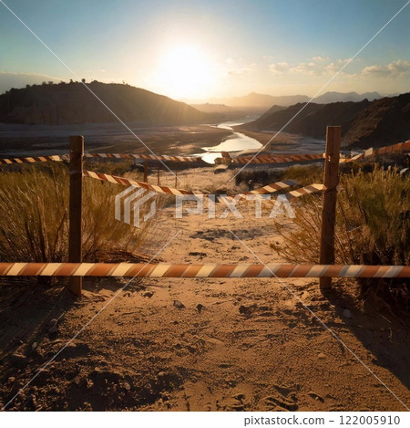 Fenced off area at sunset near a river in a desert landscape 122005910