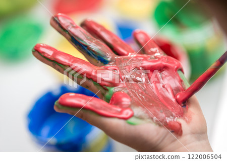 Red painted palm of a toddler Red painted palm of a toddler 122006504