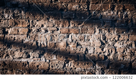 Old brick wall, dilapidated and crumbling, rough uneven material texture 122006632