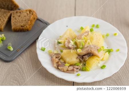 Potatoes and herring with green onions 122006939