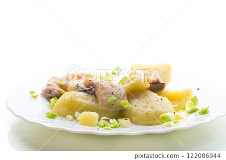 Homemade potatoes with aromatic fish, isolated on white background 122006944