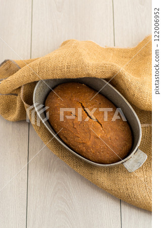 Sliced Homemade Bread on a Wooden Board Sliced Homemade Bread on a Wooden Board 122006952