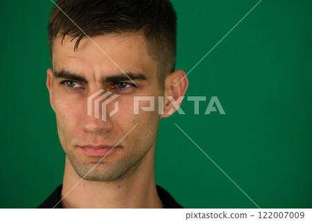 Young mistaken worried sad caucasian man 20s wear casual orange t-shirt look aside scratch hold head isolated on plain pastel light green color background studio portrait. People lifestyle concept. Young mistaken worried sad caucasian man 20s wear casual orange t-shirt look aside scratch hold head isolated on plain pastel light green color background studio portrait. People lifestyle concept. 122007009