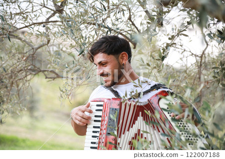 Music Sounds From Accordion In The Green Field 122007188