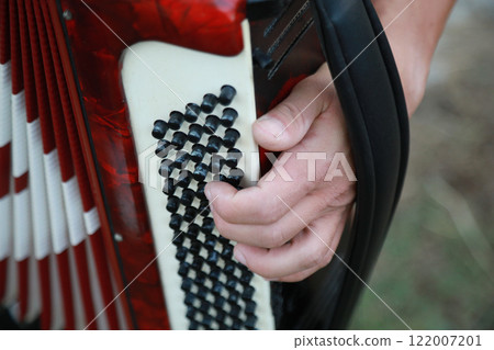 Fingers Moving Fast On The Buttons Of The Accordion Fingers Moving Fast On The Buttons Of The Accordion 122007201