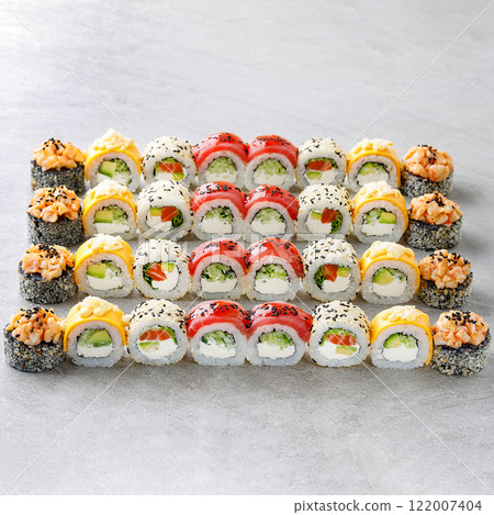 Japanese sushi rolls, sushi sets on a gray background for restaurant menu and food delivery 122007404