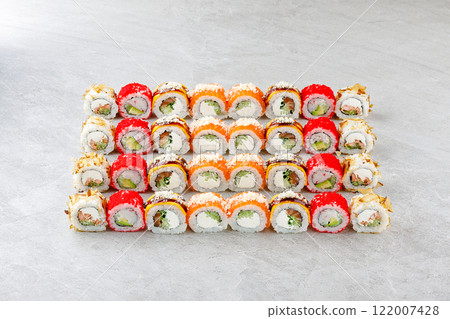 Japanese sushi rolls, sushi sets on a gray background for restaurant menu and food delivery Japanese sushi rolls, sushi sets on a gray background for restaurant menu and food delivery 122007428