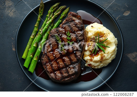 Perfectly plated wagyu steak with asparagus and creamy mashed potatoes 122008287