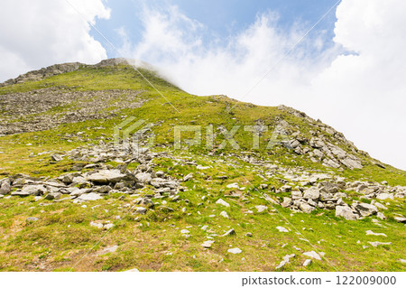 fagaras mountain ridge. fresh air. beautiful summer landscape of romania. sunny day. green rocky cliffs. majestic nature background. steep slope of transylvania alps fagaras mountain ridge. fresh air. beautiful summer landscape of romania. sunny day. green rocky cliffs. majestic nature background. steep slope of transylvania alps 122009000