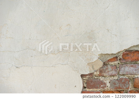 Aged Wall With Exposed Red Bricks and Cracked Plaster Surface Aged Wall With Exposed Red Bricks and Cracked Plaster Surface 122009990