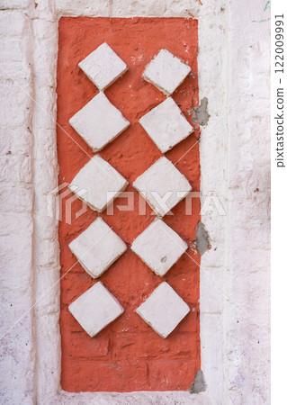 Wall Decoration Featuring Six White Circles on a Red Brick Background 122009991