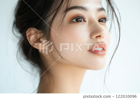 A Wonderful Portrait of a Smiling Asian Young Woman A Wonderful Portrait of a Smiling Asian Young Woman 122010096