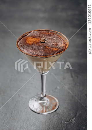 Elegant espresso martini with a dusting of cocoa and coffee beans, perfect for cocktail lovers Elegant espresso martini with a dusting of cocoa and coffee beans, perfect for cocktail lovers 122010651
