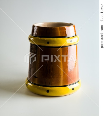 Empty clay beer mug on a white background. Empty clay beer mug on a white background. 122010692