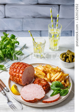 boneless smoked ham with fried potatoes on plate boneless smoked ham with fried potatoes on plate 122012932