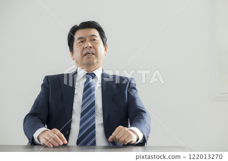Businessman holding his head Businessman holding his head 122013270