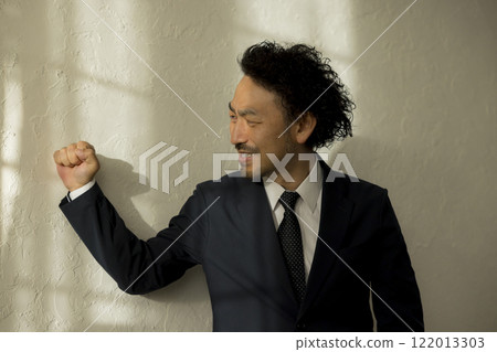 Businessman holding his head Businessman holding his head 122013303