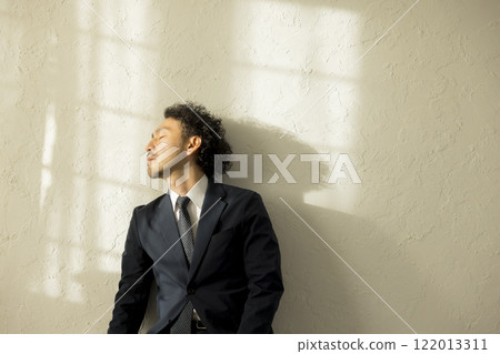Businessman holding his head Businessman holding his head 122013311