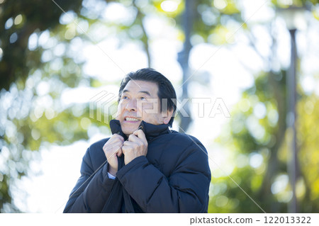 Senior man in a suit in the park Senior man in a suit in the park 122013322