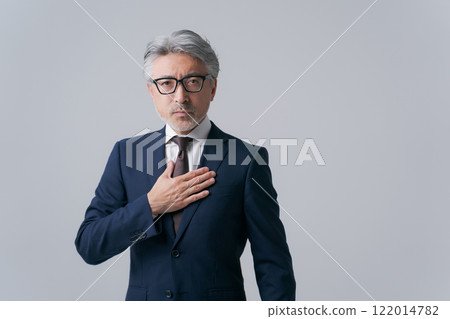 Businessman hitting his chest 122014782