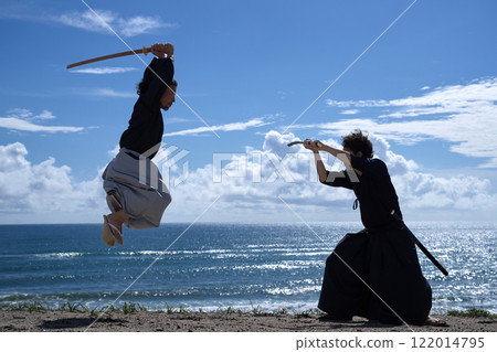 Two samurai facing off on the beach 122014795