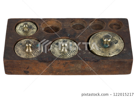Vintage wooden box with scale weights set on white 122015217