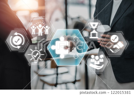 Visual representation of teamwork and collaboration with puzzle pieces and handshake, symbolizing partnership and success. Visual representation of teamwork and collaboration with puzzle pieces and handshake, symbolizing partnership and success. 122015381