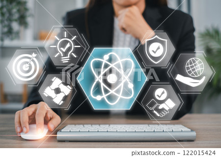 Businesswoman interacting with digital icons symbolizing core values like innovation, teamwork, and responsibility. 122015424