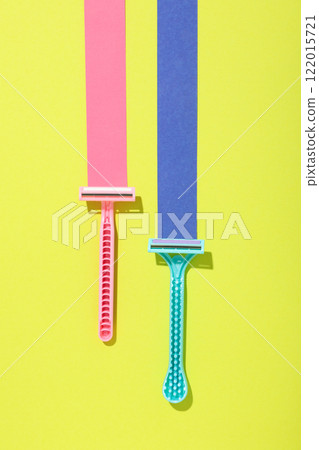 Razors for shaving on a yellow background Razors for shaving on a yellow background 122015721