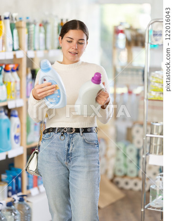 Woman choosing fabric softener Woman choosing fabric softener 122016043