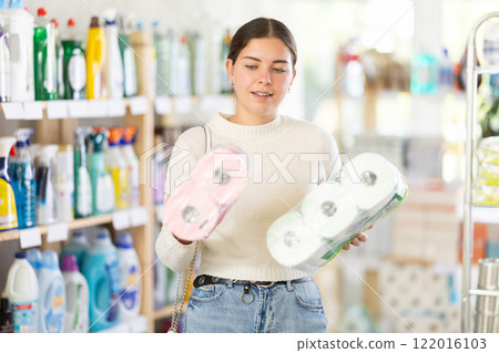 Woman choosing toilet paper kits 122016103