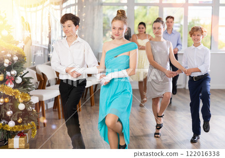 Boys and girls dancing folk dances in studio 122016338