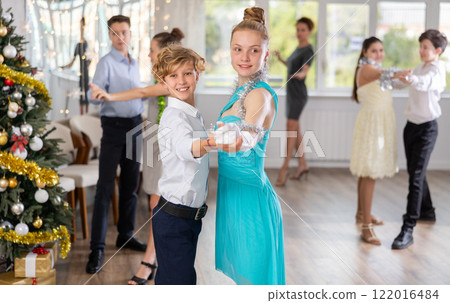 Boy and girl dancing waltz in studio 122016484