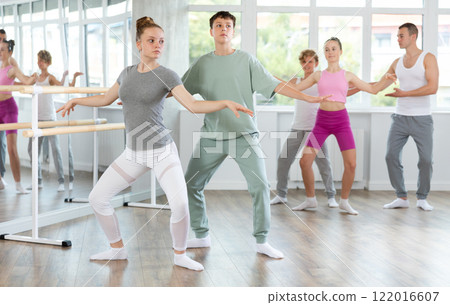 Ballet training for teenagers in a ballet studio under the guidance of choreographer 122016607