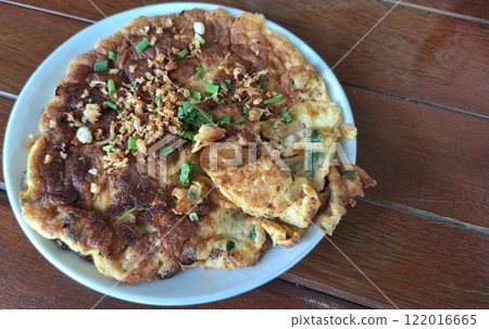 The omelet is crispy on the outside and soft on the inside. The omelet is crispy on the outside and soft on the inside. 122016665