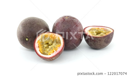 Fresh passion fruits showing pulp and seeds on white background 122017074