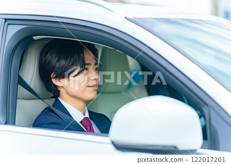 A man driving a car 122017201
