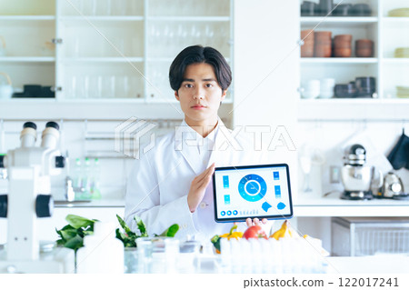 A researcher explaining while showing the screen on a tablet 122017241