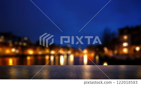 An empty city street with a view of the canal and colorful bokeh lights of cityscape lights in the night. Mockup or template. Copy space. Abstract blurred wallpaper or background An empty city street with a view of the canal and colorful bokeh lights of cityscape lights in the night. Mockup or template. Copy space. Abstract blurred wallpaper or background 122018583