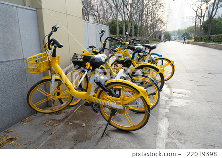Rental bikes on a sidewalk in Shanghai, China. Rental bikes on a sidewalk in Shanghai, China. 122019398