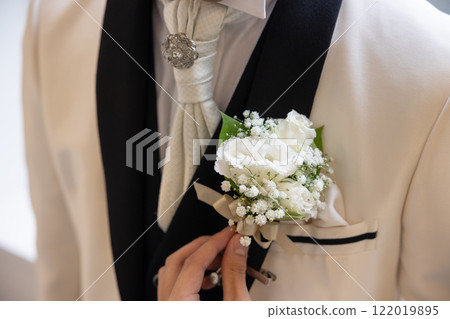 Close-up photo of the groom's chest in a black tie 122019895