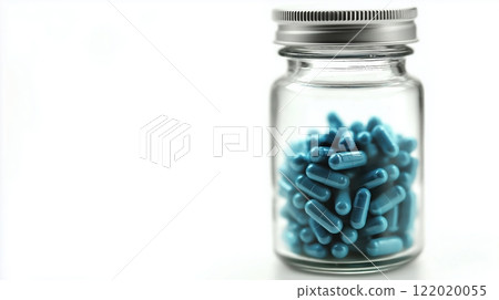 Glass jar filled with blue medical capsules against white background, featuring metallic screw cap and soft focus edges, demonstrating pharmaceutical product presentation. Healthcare supplement Glass jar filled with blue medical capsules against white background, featuring metallic screw cap and soft focus edges, demonstrating pharmaceutical product presentation. Healthcare supplement 122020055