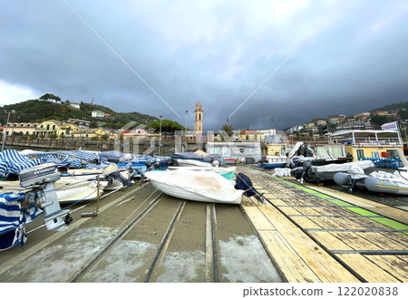 Boats in marina covered with covers. Fishing and season. Sea and lifestyle. Boats in marina covered with covers. Fishing and season. Sea and lifestyle. 122020838