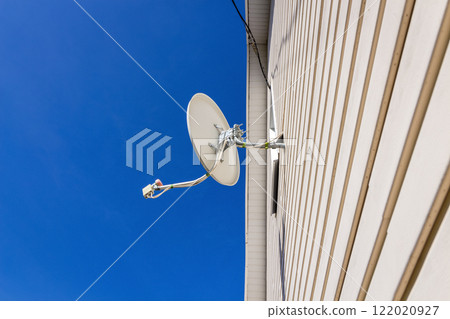 Satellite dish on a house Satellite dish on a house 122020927